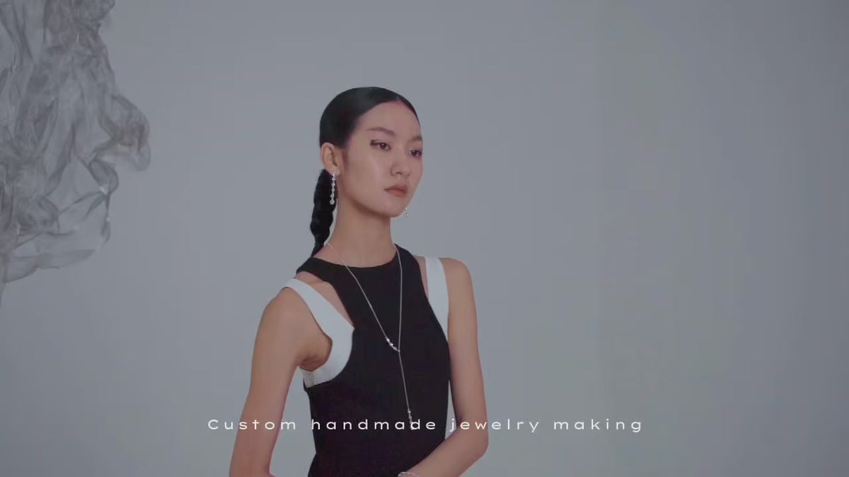 Load video: Custom handmade jewelry collection worn by model, showcasing unique handcrafted pieces. Each piece is carefully made just for you.